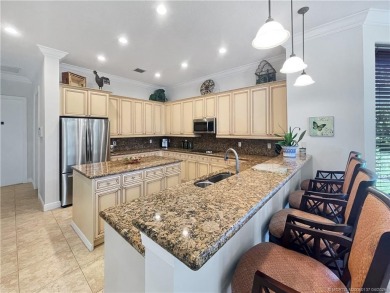 PRIVATE LAKESIDE RETREAT - This updated 5 BR, 6 bath, 4 garage on The Cape Club of Palm City in Florida - for sale on GolfHomes.com, golf home, golf lot