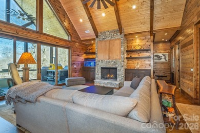 Set along the pristine shoreline of Ticoa Lake in the highly on Connestee Falls Golf Club in North Carolina - for sale on GolfHomes.com, golf home, golf lot