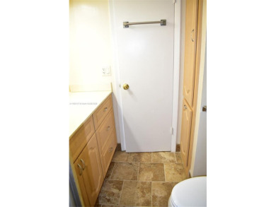 COMPLETE HURRICANE PROTECTION, a KITCHEN WALL HAS BEEN OPENED UP on Sunrise Lakes Phase III in Florida - for sale on GolfHomes.com, golf home, golf lot