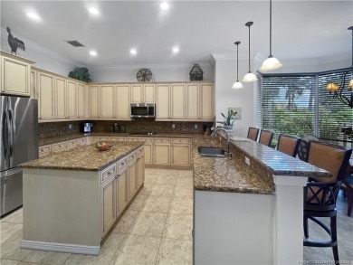 PRIVATE LAKESIDE RETREAT - This updated 5 BR, 6 bath, 4 garage on The Cape Club of Palm City in Florida - for sale on GolfHomes.com, golf home, golf lot