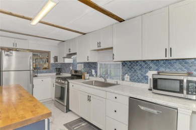 Located in the 55 +deed restricted Community of Holiday Park on Sabal Trace Golf and Country Club in Florida - for sale on GolfHomes.com, golf home, golf lot