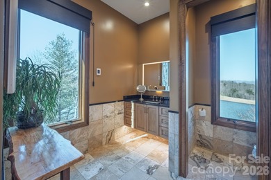 Set along the pristine shoreline of Ticoa Lake in the highly on Connestee Falls Golf Club in North Carolina - for sale on GolfHomes.com, golf home, golf lot