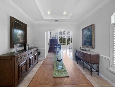 PRIVATE LAKESIDE RETREAT - This updated 5 BR, 6 bath, 4 garage on The Cape Club of Palm City in Florida - for sale on GolfHomes.com, golf home, golf lot