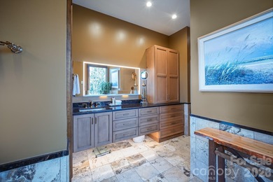 Set along the pristine shoreline of Ticoa Lake in the highly on Connestee Falls Golf Club in North Carolina - for sale on GolfHomes.com, golf home, golf lot