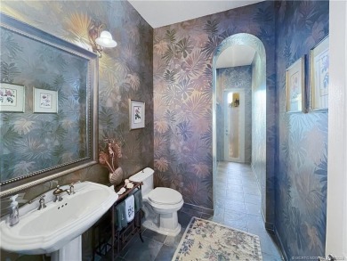 PRIVATE LAKESIDE RETREAT - This updated 5 BR, 6 bath, 4 garage on The Cape Club of Palm City in Florida - for sale on GolfHomes.com, golf home, golf lot