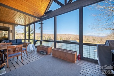 Set along the pristine shoreline of Ticoa Lake in the highly on Connestee Falls Golf Club in North Carolina - for sale on GolfHomes.com, golf home, golf lot