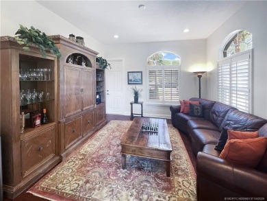 PRIVATE LAKESIDE RETREAT - This updated 5 BR, 6 bath, 4 garage on The Cape Club of Palm City in Florida - for sale on GolfHomes.com, golf home, golf lot
