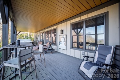 Set along the pristine shoreline of Ticoa Lake in the highly on Connestee Falls Golf Club in North Carolina - for sale on GolfHomes.com, golf home, golf lot