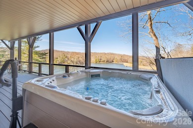 Set along the pristine shoreline of Ticoa Lake in the highly on Connestee Falls Golf Club in North Carolina - for sale on GolfHomes.com, golf home, golf lot