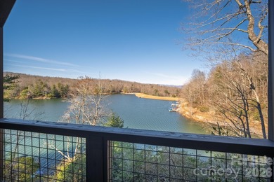 Set along the pristine shoreline of Ticoa Lake in the highly on Connestee Falls Golf Club in North Carolina - for sale on GolfHomes.com, golf home, golf lot