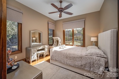 Set along the pristine shoreline of Ticoa Lake in the highly on Connestee Falls Golf Club in North Carolina - for sale on GolfHomes.com, golf home, golf lot