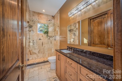 Set along the pristine shoreline of Ticoa Lake in the highly on Connestee Falls Golf Club in North Carolina - for sale on GolfHomes.com, golf home, golf lot