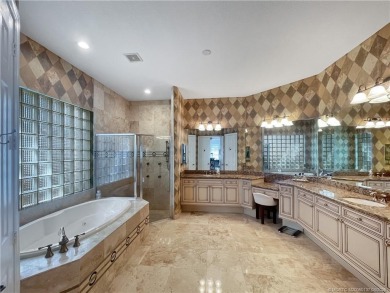 PRIVATE LAKESIDE RETREAT - This updated 5 BR, 6 bath, 4 garage on The Cape Club of Palm City in Florida - for sale on GolfHomes.com, golf home, golf lot