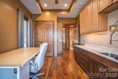 Set along the pristine shoreline of Ticoa Lake in the highly on Connestee Falls Golf Club in North Carolina - for sale on GolfHomes.com, golf home, golf lot