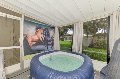 Located in the 55 +deed restricted Community of Holiday Park on Sabal Trace Golf and Country Club in Florida - for sale on GolfHomes.com, golf home, golf lot