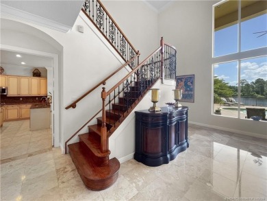 PRIVATE LAKESIDE RETREAT - This updated 5 BR, 6 bath, 4 garage on The Cape Club of Palm City in Florida - for sale on GolfHomes.com, golf home, golf lot