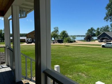 Roy Lake back lot home located on Roykota Dr. Lake City, SD with on Roy View Golf Course in South Dakota - for sale on GolfHomes.com, golf home, golf lot