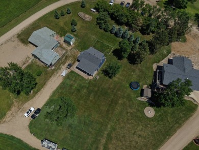 Roy Lake back lot home located on Roykota Dr. Lake City, SD with on Roy View Golf Course in South Dakota - for sale on GolfHomes.com, golf home, golf lot
