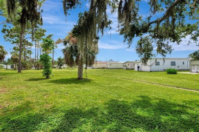 Located in the 55 +deed restricted Community of Holiday Park on Sabal Trace Golf and Country Club in Florida - for sale on GolfHomes.com, golf home, golf lot