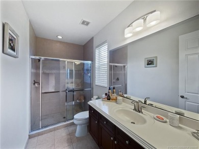PRIVATE LAKESIDE RETREAT - This updated 5 BR, 6 bath, 4 garage on The Cape Club of Palm City in Florida - for sale on GolfHomes.com, golf home, golf lot