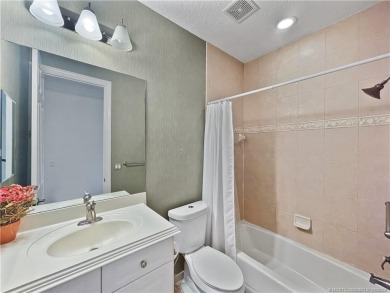 PRIVATE LAKESIDE RETREAT - This updated 5 BR, 6 bath, 4 garage on The Cape Club of Palm City in Florida - for sale on GolfHomes.com, golf home, golf lot
