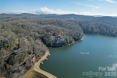 Set along the pristine shoreline of Ticoa Lake in the highly on Connestee Falls Golf Club in North Carolina - for sale on GolfHomes.com, golf home, golf lot