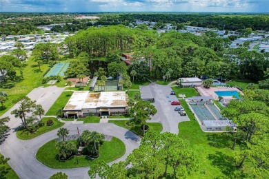 Located in the 55 +deed restricted Community of Holiday Park on Sabal Trace Golf and Country Club in Florida - for sale on GolfHomes.com, golf home, golf lot