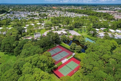 Located in the 55 +deed restricted Community of Holiday Park on Sabal Trace Golf and Country Club in Florida - for sale on GolfHomes.com, golf home, golf lot