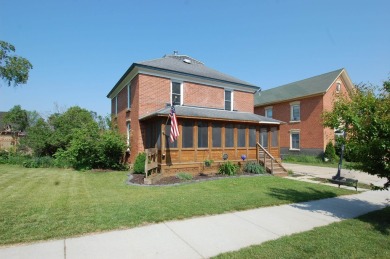 Nestled on a quiet, tree-lined street within walking distance on Spring Green Golf Course in Wisconsin - for sale on GolfHomes.com, golf home, golf lot