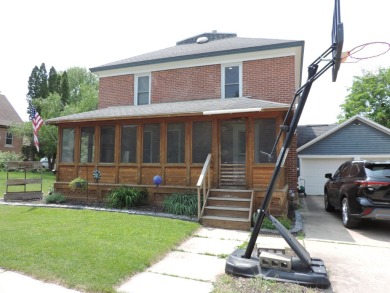 Nestled on a quiet, tree-lined street within walking distance on Spring Green Golf Course in Wisconsin - for sale on GolfHomes.com, golf home, golf lot