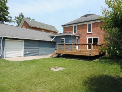 Nestled on a quiet, tree-lined street within walking distance on Spring Green Golf Course in Wisconsin - for sale on GolfHomes.com, golf home, golf lot