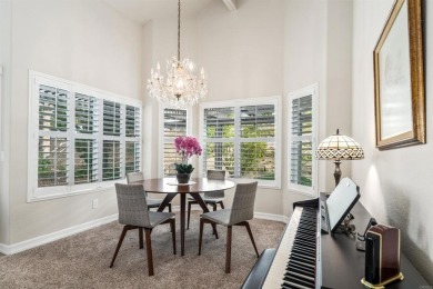 The open-concept family and dining area creates a welcoming on Ocean Hills Country Club in California - for sale on GolfHomes.com, golf home, golf lot