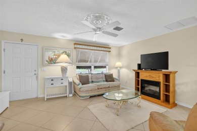 This charming 2/2 Austin Model, located in the desirable Village on The Links of Spruce Creek in Florida - for sale on GolfHomes.com, golf home, golf lot