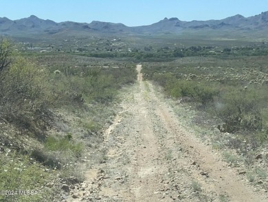 This property backs up against government land at the base of on Tubac Golf Resort and Spa in Arizona - for sale on GolfHomes.com, golf home, golf lot