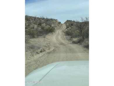 This property backs up against government land at the base of on Tubac Golf Resort and Spa in Arizona - for sale on GolfHomes.com, golf home, golf lot