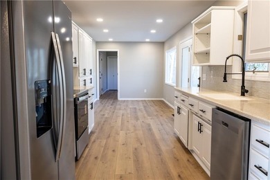 This completely remodeled 3-bedroom, 2-bath home offers modern on Bella Vista Country Club and Golf Course in Arkansas - for sale on GolfHomes.com, golf home, golf lot