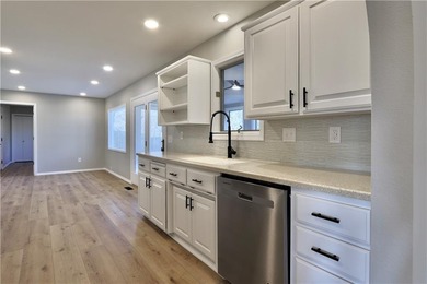 This completely remodeled 3-bedroom, 2-bath home offers modern on Bella Vista Country Club and Golf Course in Arkansas - for sale on GolfHomes.com, golf home, golf lot