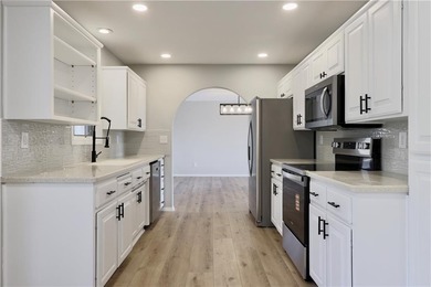 This completely remodeled 3-bedroom, 2-bath home offers modern on Bella Vista Country Club and Golf Course in Arkansas - for sale on GolfHomes.com, golf home, golf lot