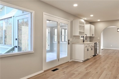 This completely remodeled 3-bedroom, 2-bath home offers modern on Bella Vista Country Club and Golf Course in Arkansas - for sale on GolfHomes.com, golf home, golf lot