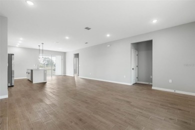 One or more photo(s) has been virtually staged. Walk to Pine on The Grand Club - Pine Lakes Course in Florida - for sale on GolfHomes.com, golf home, golf lot