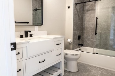 This completely remodeled 3-bedroom, 2-bath home offers modern on Bella Vista Country Club and Golf Course in Arkansas - for sale on GolfHomes.com, golf home, golf lot