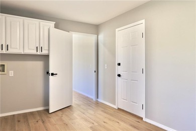 This completely remodeled 3-bedroom, 2-bath home offers modern on Bella Vista Country Club and Golf Course in Arkansas - for sale on GolfHomes.com, golf home, golf lot