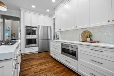 Nestled in the heart of Alpharetta this renovated home in on The Golf Club of Georgia in Georgia - for sale on GolfHomes.com, golf home, golf lot