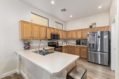 This beautifully maintained 5-bedroom, 3-bath home features a on Augusta Ranch Golf Club in Arizona - for sale on GolfHomes.com, golf home, golf lot