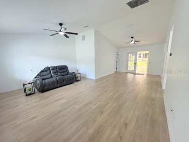 COME AND SEE THIS GORGEOUS REMODELED HOME!  THIS IS LIKE A NEW on Eagle Ridge At Spruce Creek Country Club in Florida - for sale on GolfHomes.com, golf home, golf lot