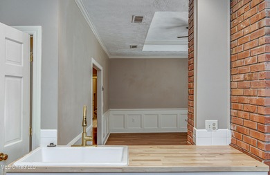 Discover this beautifully updated 3-bedroom, 2-bathroom home on Castlewoods Golf Club in Mississippi - for sale on GolfHomes.com, golf home, golf lot