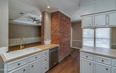 Discover this beautifully updated 3-bedroom, 2-bathroom home on Castlewoods Golf Club in Mississippi - for sale on GolfHomes.com, golf home, golf lot