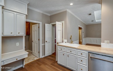 Discover this beautifully updated 3-bedroom, 2-bathroom home on Castlewoods Golf Club in Mississippi - for sale on GolfHomes.com, golf home, golf lot