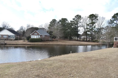 Pond building site in Wyboo Plantation . Buy now, build later on Players Course At Wyboo Plantation in South Carolina - for sale on GolfHomes.com, golf home, golf lot