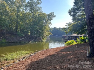 Stately new Lake Tillery home nestled in a quit cove in the on The Tillery Tradition Country Club in North Carolina - for sale on GolfHomes.com, golf home, golf lot